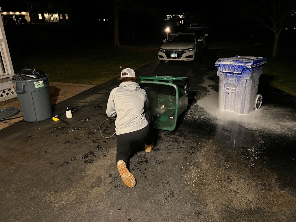 Griffin Haffey pressure washing garbage bins